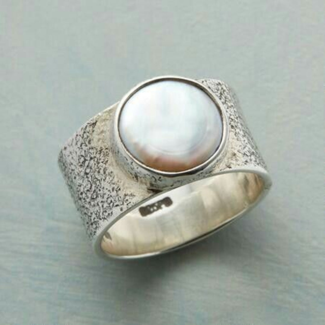 Bague vintage en argent avec perle blanche
