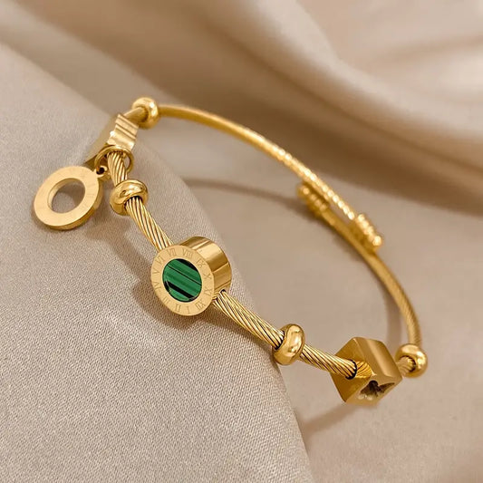 Bracelet rigide doré avec breloques géométriques - Celeste