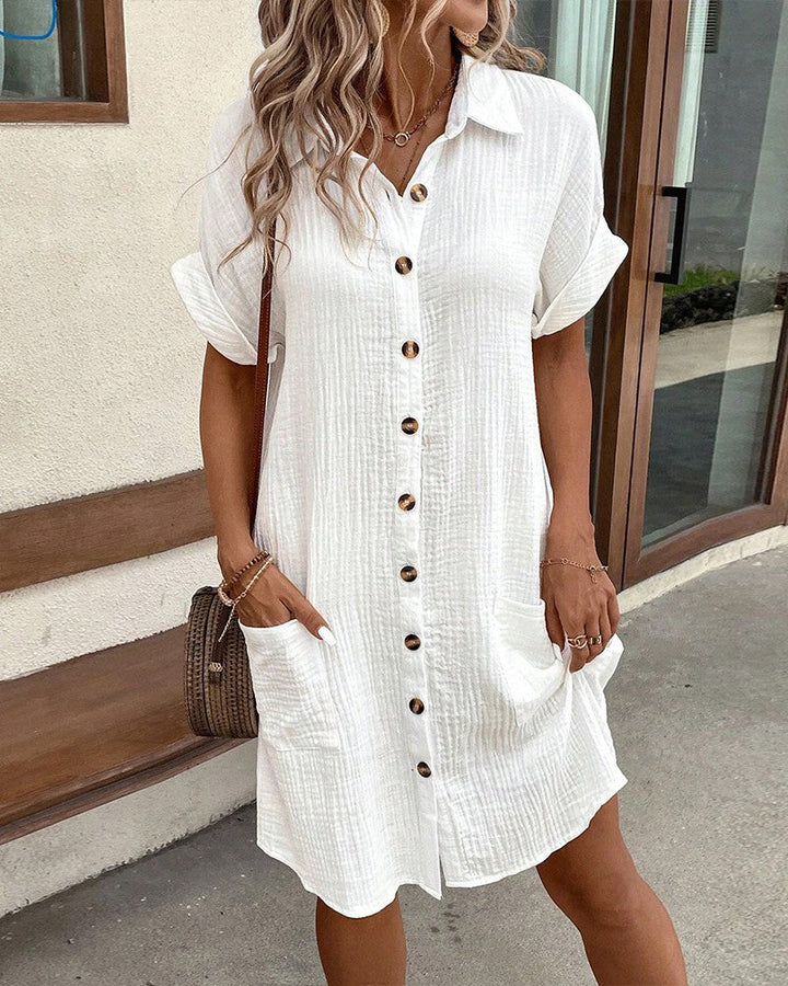 Robe chemise unie à manches courtes avec poches boutonnées