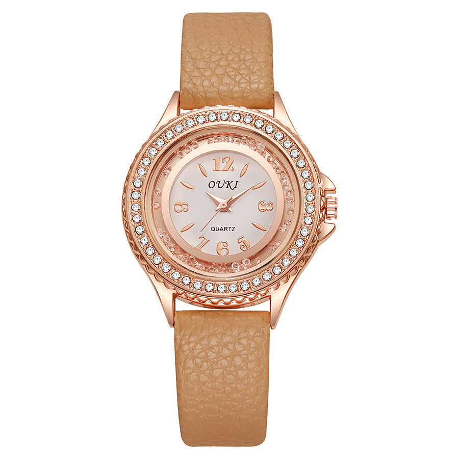 Montre Femme Ronde Avec Lunette Cristallisée Cadran Clair Et Bracelet Synthétique Léger