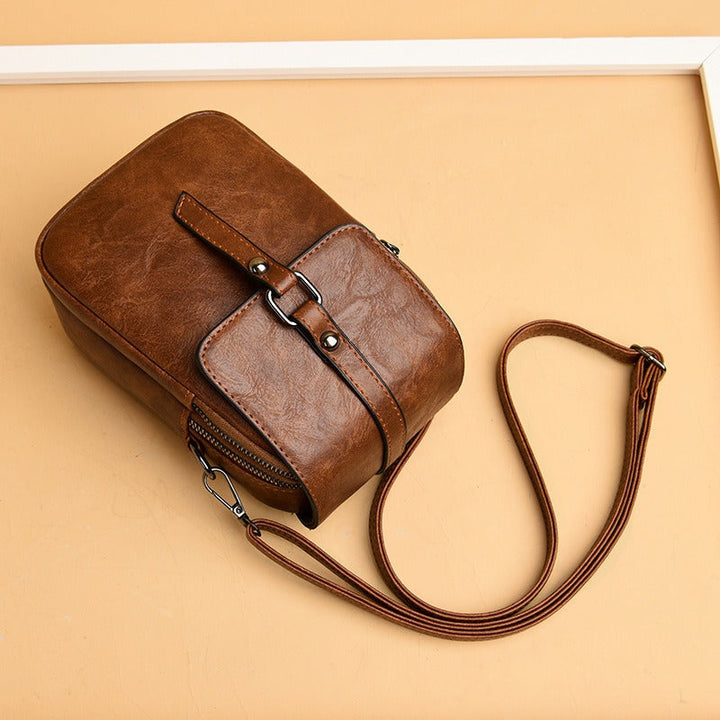 Sac à bandoulière en cuir synthétique pour femme avec poche frontale compacte - Daniela
