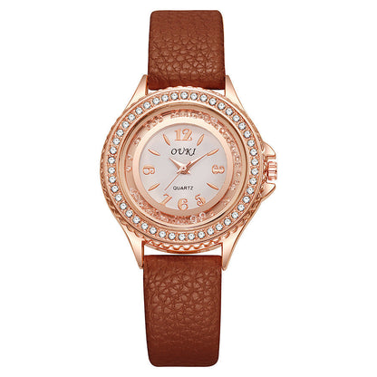Montre Femme Ronde Avec Lunette Cristallisée Cadran Clair Et Bracelet Synthétique Léger