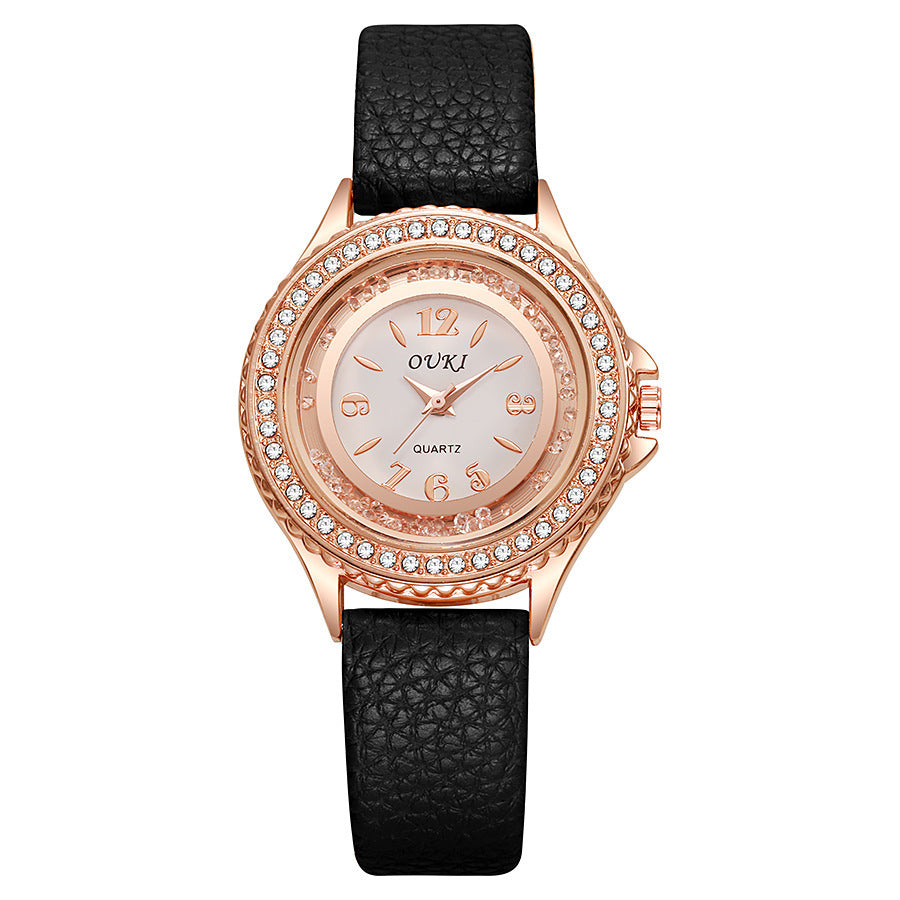 Montre Femme Ronde Avec Lunette Cristallisée Cadran Clair Et Bracelet Synthétique Léger
