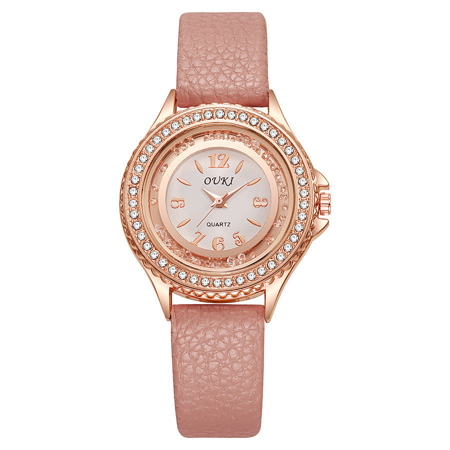 Montre Femme Ronde Avec Lunette Cristallisée Cadran Clair Et Bracelet Synthétique Léger