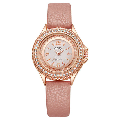 Montre Femme Ronde Avec Lunette Cristallisée Cadran Clair Et Bracelet Synthétique Léger