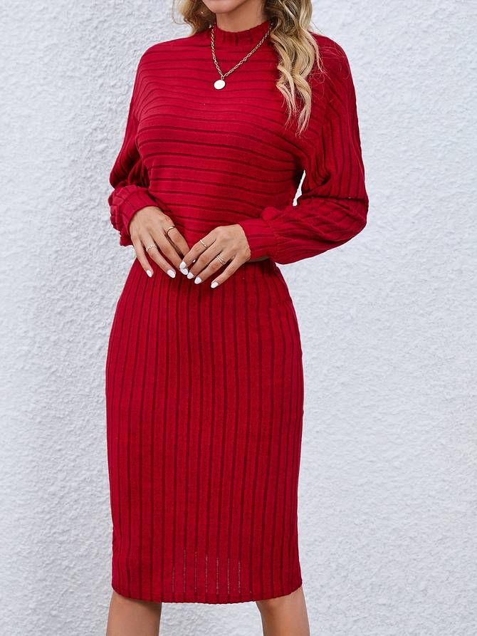 Ensemble élégant composé d'un top et d'une jupe souples à manches longues et col rond, parfaits pour un look raffiné et confortable en toute occasion.