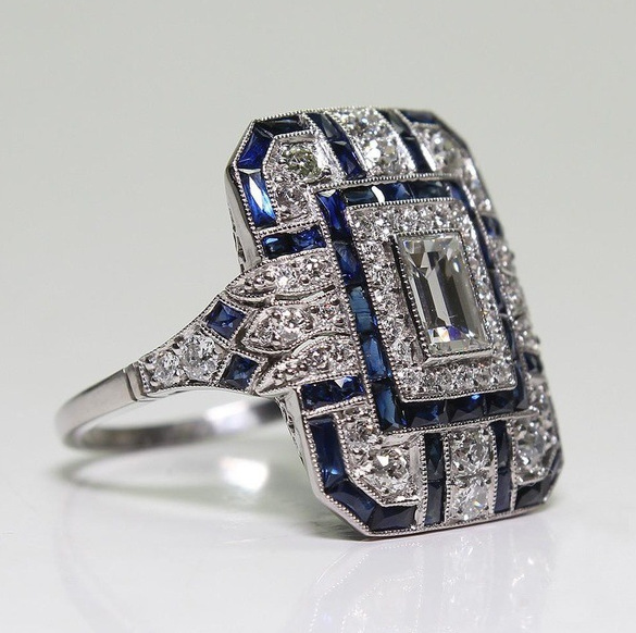 Bague vintage en argent poli et zircon bleu